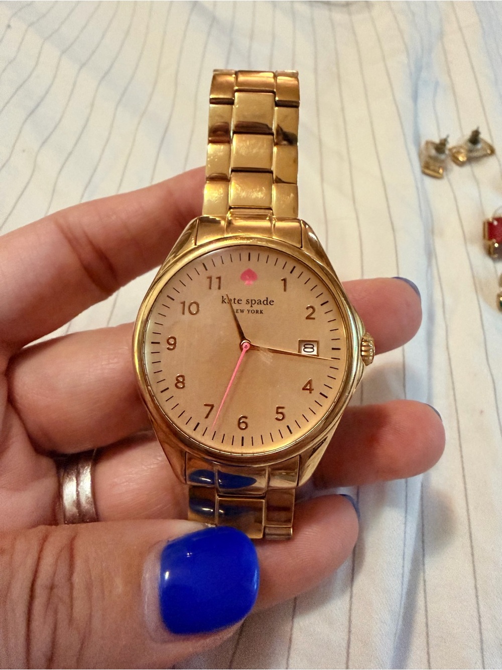BATCH of Kate Spade accessories: gold watch, stud earrings, bangles